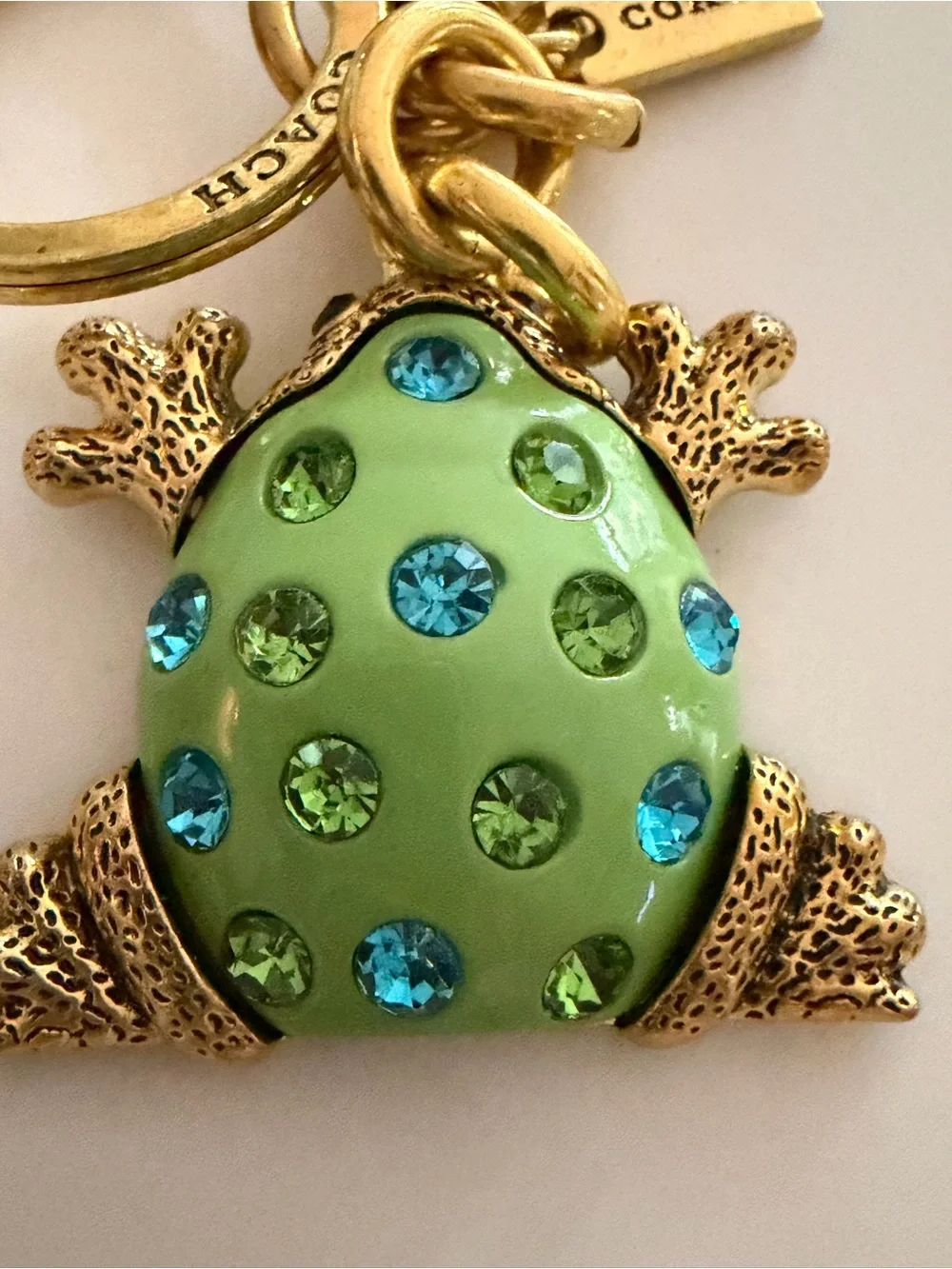 COACH Gold-Tone Green Frog Brooch with Blue and Green Crystals